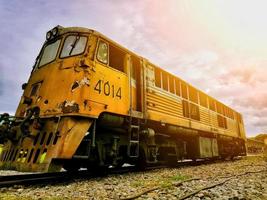 Colorful diesel old train  stop on train station photo