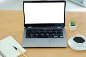 Laptop and gadgets on table photo