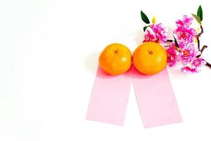 Flat lay Chinese New Year Background Mandarin Orange, Red Envelop and Flower on white background. photo