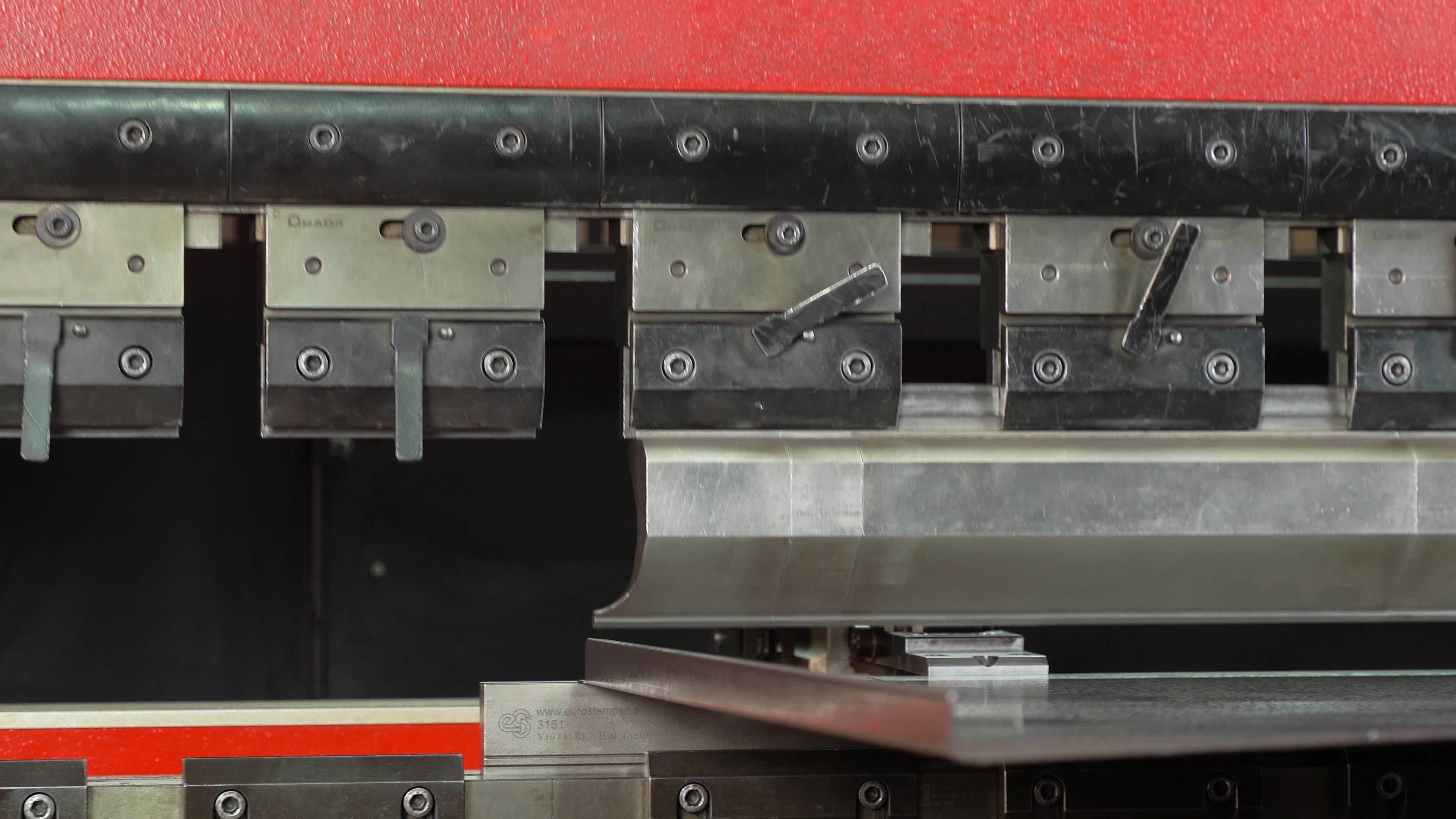 Metal bending, aluminum bending. The technician bends the metal piece