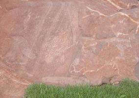 Brown stone with large patterns that are designed to be like nature by heavy machinery, beautifully crafted in a vast lakeside garden, perfect for relaxing and watching nature in summer and winter. photo