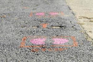 Foot symbols on the ground tell people to keep people 6 feet apart during the coronavirus outbreak in many countries around the world and common filtering points. photo