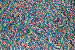 The Thai pattern is a delicate fine art created by craftsmen on the wooden floors of the Thai temple windows and walls. photo