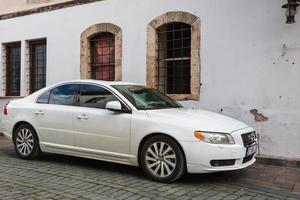 Side Turkey  February 20 2022  white Volve s60   is parked  on the street on a warm  day against the backdrop of a buildung photo