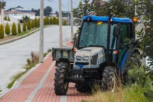 Side Turkey February  20, 2022 blue  Tractor  is parked  on the street on a warm summer day photo