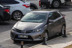 Side Turkey February  20, 2022 gray Toyota Auris    is  parking on the street on a warm autumn day photo