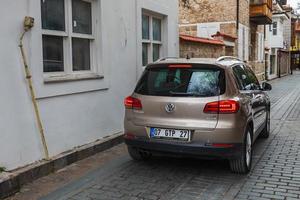 Side Turkey  February 20 2022   brown Volkswagen Tiguan is parked  on the street on a warm day photo