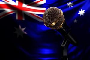 Microphone on the background of the National Flag of Australia, realistic 3d illustration. music award, karaoke, radio and recording studio sound equipment photo