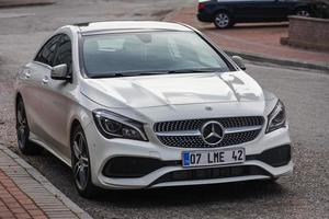 Side Turkey  February 20 2022   white Mercedes Benz CLA class  250is parked  on the street on a warm  day photo