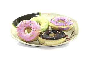 Colorful chocolate-covered donuts are a popular fast food dish in the United States and around the world. It is a high-calorie fast food that is popular with people around the world. photo