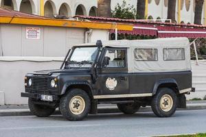 Side  Turkey  February 18 2022  white  Land Rover Defender  parked on the street on a warm summer day photo