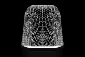 3d illustration close up of a metal microphone on a black background photo