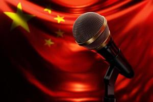 micrófono en el fondo de la bandera nacional de china, ilustración 3d realista. premio de música, karaoke, radio y equipo de sonido de estudio de grabación foto