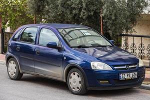 Side  Turkey   February 20 2022 blue Opel Corsa is parked  on the street on a warm day photo