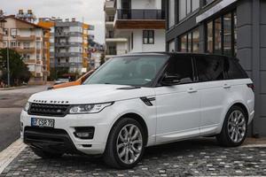 Side Turkey  March 03 2022  white Land Rover Range Rover Sport  is parked  on the street on a warm day photo