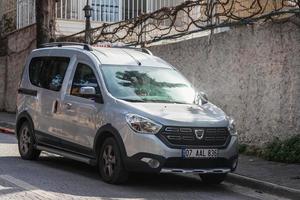 Side Turkey  February 20 2022   silver Dacia Dokker  parked on the street on a warm summer day against the backdrop of   historical centre photo