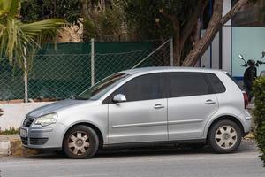 Side Turkey  February 20 2022 silver  Volkswagen Polo   is parked  on the street on a warm  day against the backdrop of a buildung, park photo