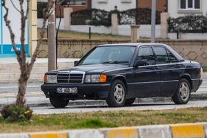 Side Turkey  February 23 , 2022  black Mercedes Benz Eclass is parked  on the street on a warm  day photo