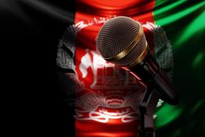 Microphone on the background of the National Flag of Afghanistan, realistic 3d illustration. music award, karaoke, radio and recording studio sound equipment photo