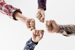 young business people putting their hands together photo