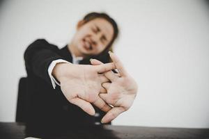 Asian business woman relaxing in her chair at the office photo