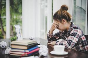 woman sitting down, his face unsettled photo