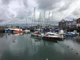 Padstow in Cornwall in August 2020. A view of Padstow Harbour showing all the fishing boats photo