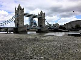 A view of Tower Bridge in London with drawbridge opening photo