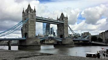 A view of Tower Bridge in London with drawbridge opening photo