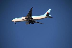 London in the UK in November 2020. A view of a plane passing over Richmond Park photo