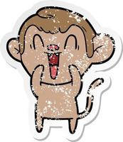 distressed sticker of a cartoon laughing monkey vector