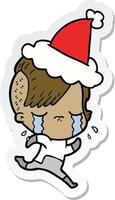 sticker cartoon of a crying girl wearing space clothes wearing santa hat vector