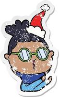 distressed sticker cartoon of a woman wearing spectacles wearing santa hat vector