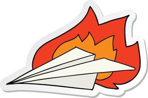 sticker of a cartoon burning paper airplane vector