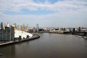 An aerial view of London over the River Thames near the Isle of Dogs photo