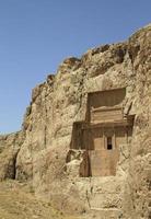 The massive tombs of Persian kings Darius and Xerxes near Persepolis in Iran photo