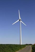 Sustainable energy - wind turbine on a field photo