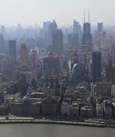 Smog clouds obscuring the skyscraper skyline of Shanghai, China photo