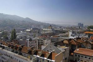 Sarajevo, Bosnia and Herzegovina - June 5, 2022 - Beautiful view over the city of Sarajevo with hills in the background on a sunny day. photo