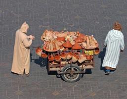 Marrakech, Morocco - September 12, 2014 - Man selling traditional Moroccan pottery on a city square in Marrakech, Morocco photo