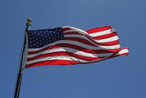 American flag waving in the wind photo