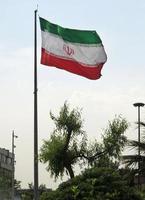 Big Iranian flag in the wind in Tehran, Iran photo