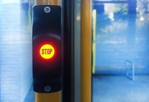 Bright STOP button on a tram photo