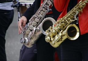Two saxophone players during a performance photo