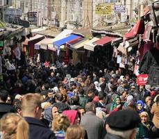 Istanbul, Turkey - June 12, 2017 - Big crowd of people moving through a very busy shopping street in Istanbul, Turkey. photo