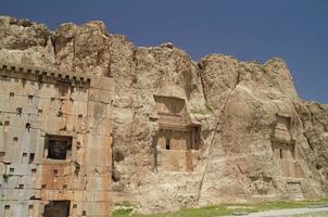 The massive tombs of Persian kings Darius and Xerxes near Persepolis in Iran photo
