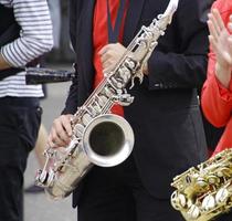 Two saxophone players during a performance photo