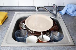 dirty dishes in sink photo