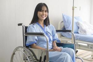 Hopeful and happy young patient woman in hospital, healthcare and medical concept photo