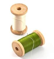 Isolated spools of thread photo